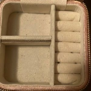 Pink jewelry box storage with mirror and mirror cleaner